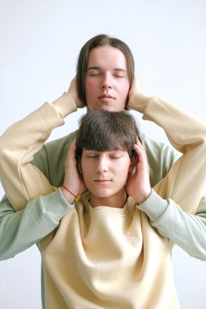 men caressing their heads